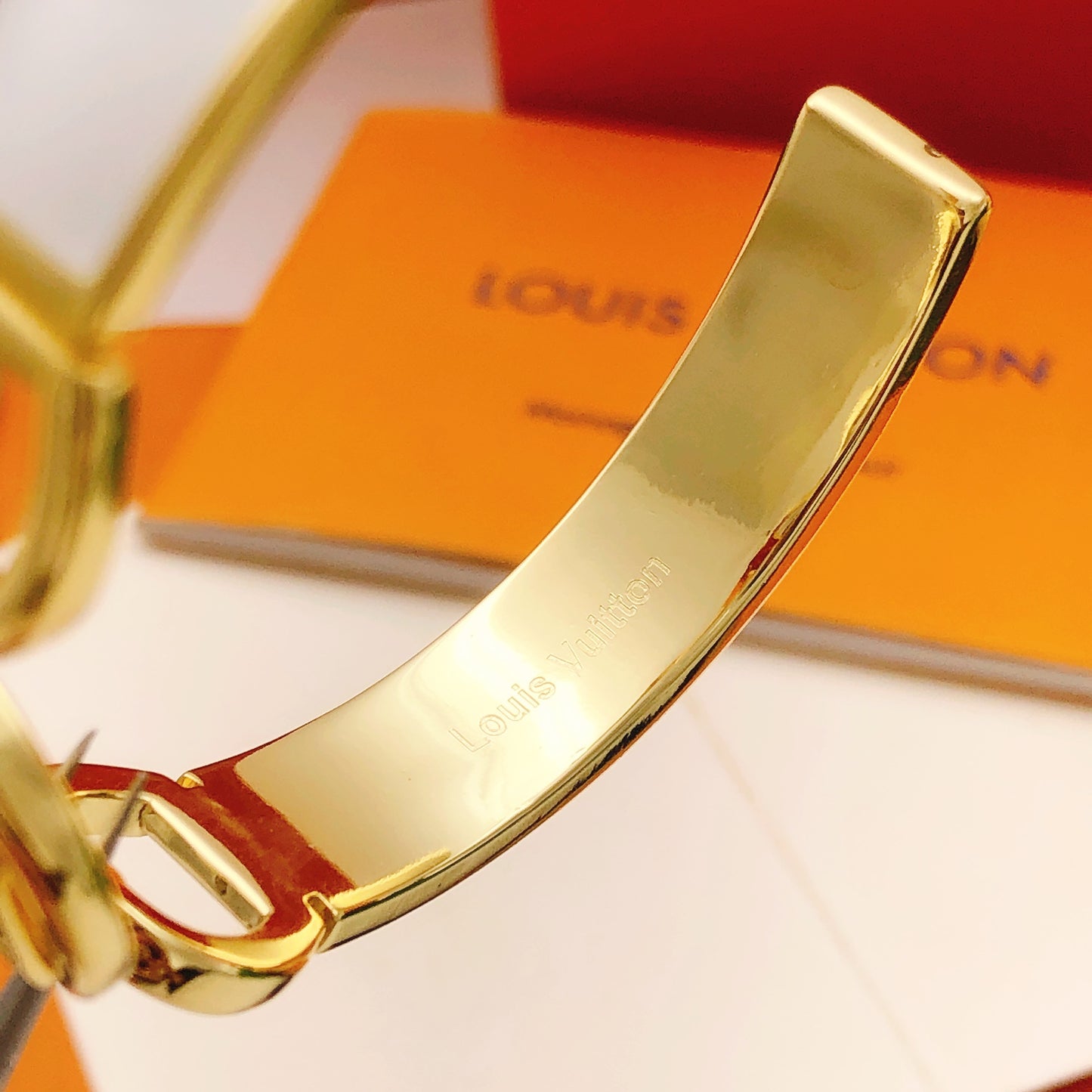 Geometric Emblem Bangle in Gold-Tone – White Detail styled product view