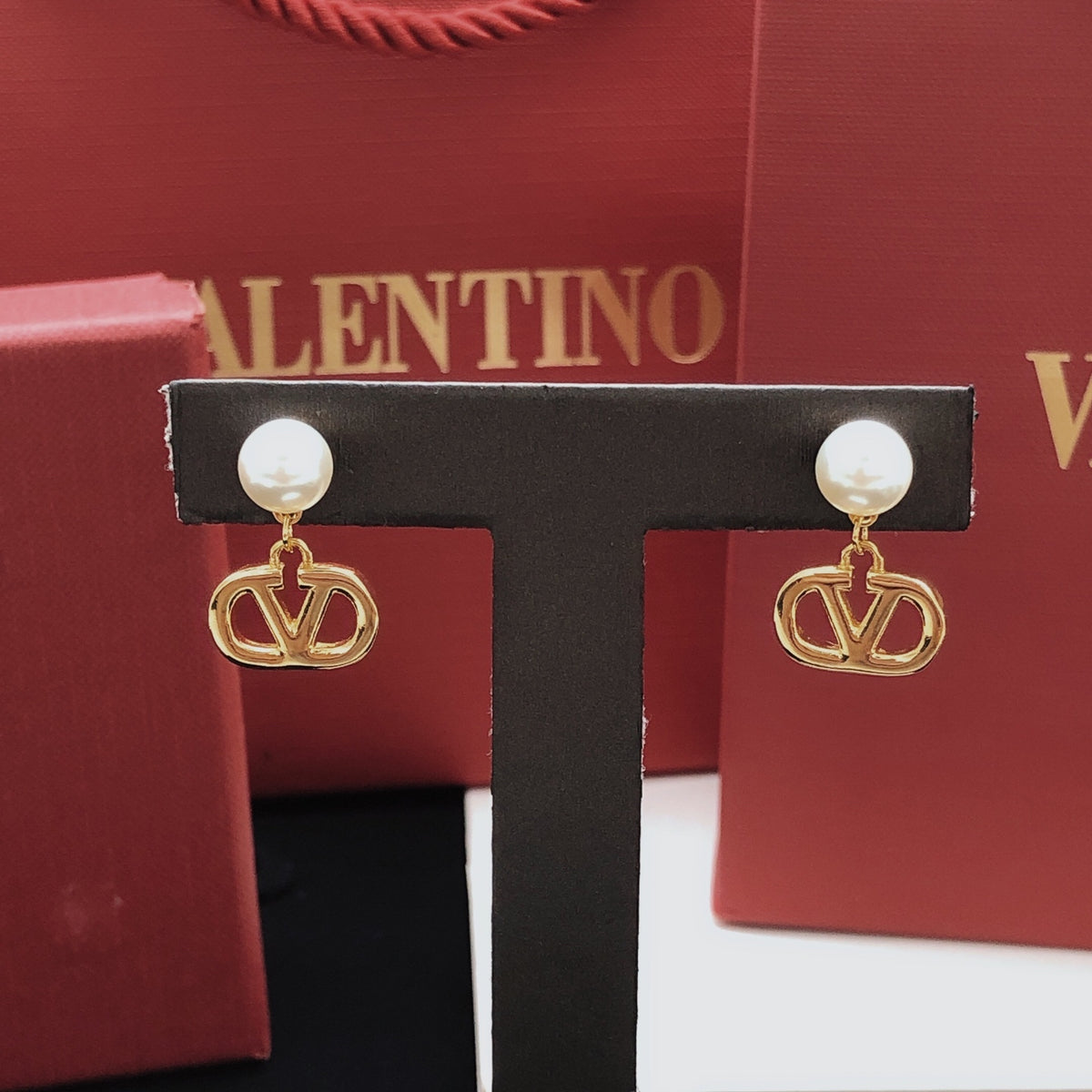 Signature Emblem Polished Stud Earrings – Design 05 close-up view