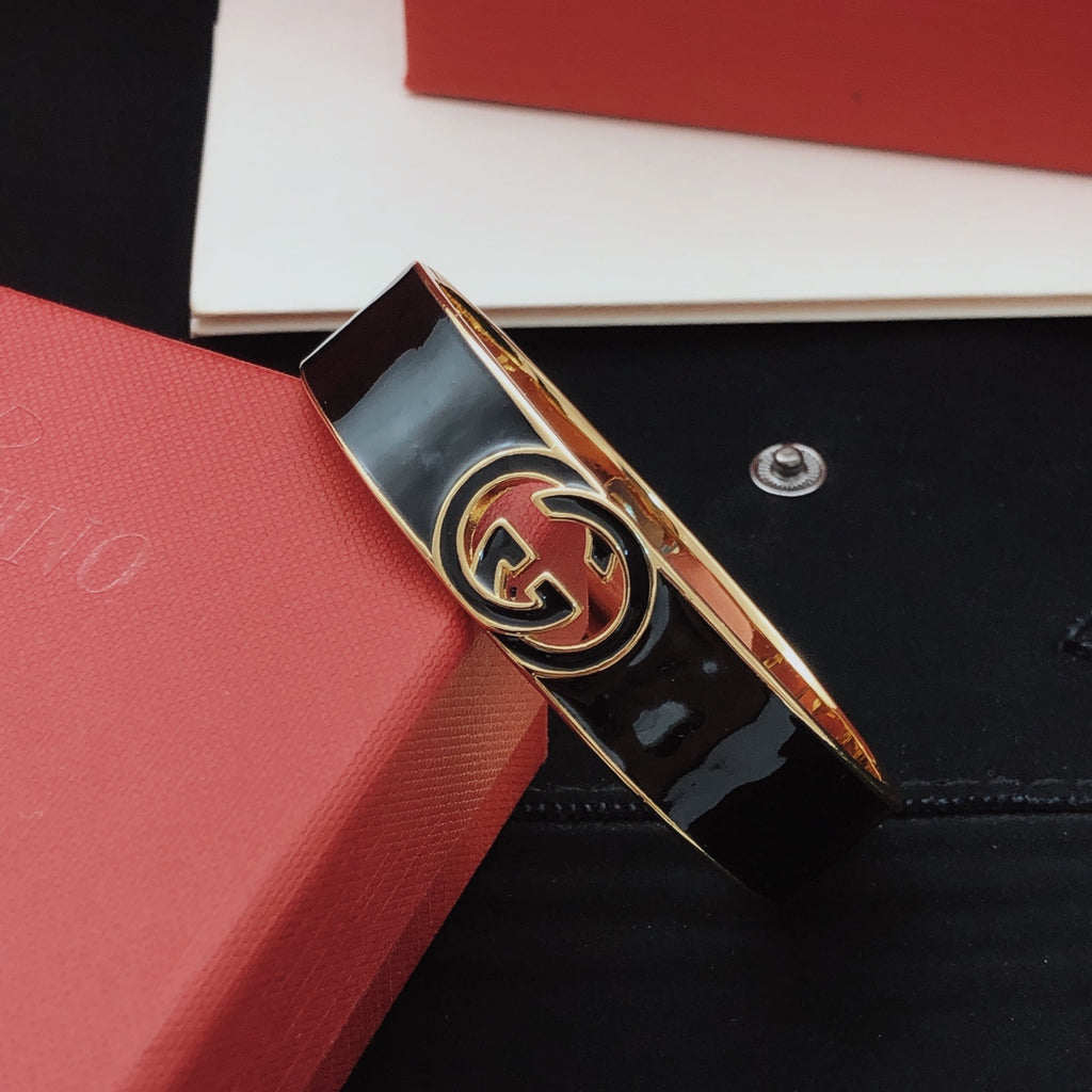 Geometric Emblem Bangle in Gold-Tone – Black Detail close-up detail