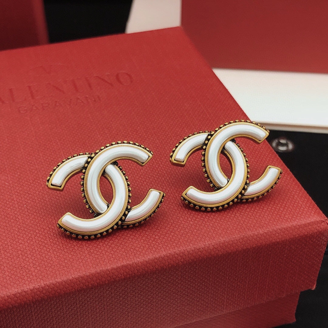 Double-C Emblem Stud Earrings in Gold-Tone – White Detail detail view