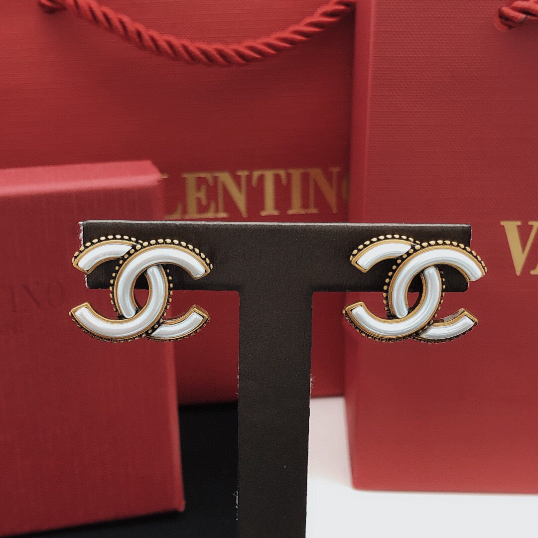 Double-C Emblem Stud Earrings in Gold-Tone – White Detail detail view