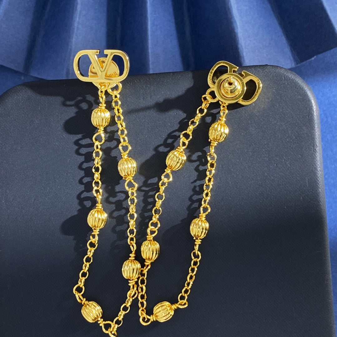 V Emblem Stud Earrings in Gold-Tone main product view
