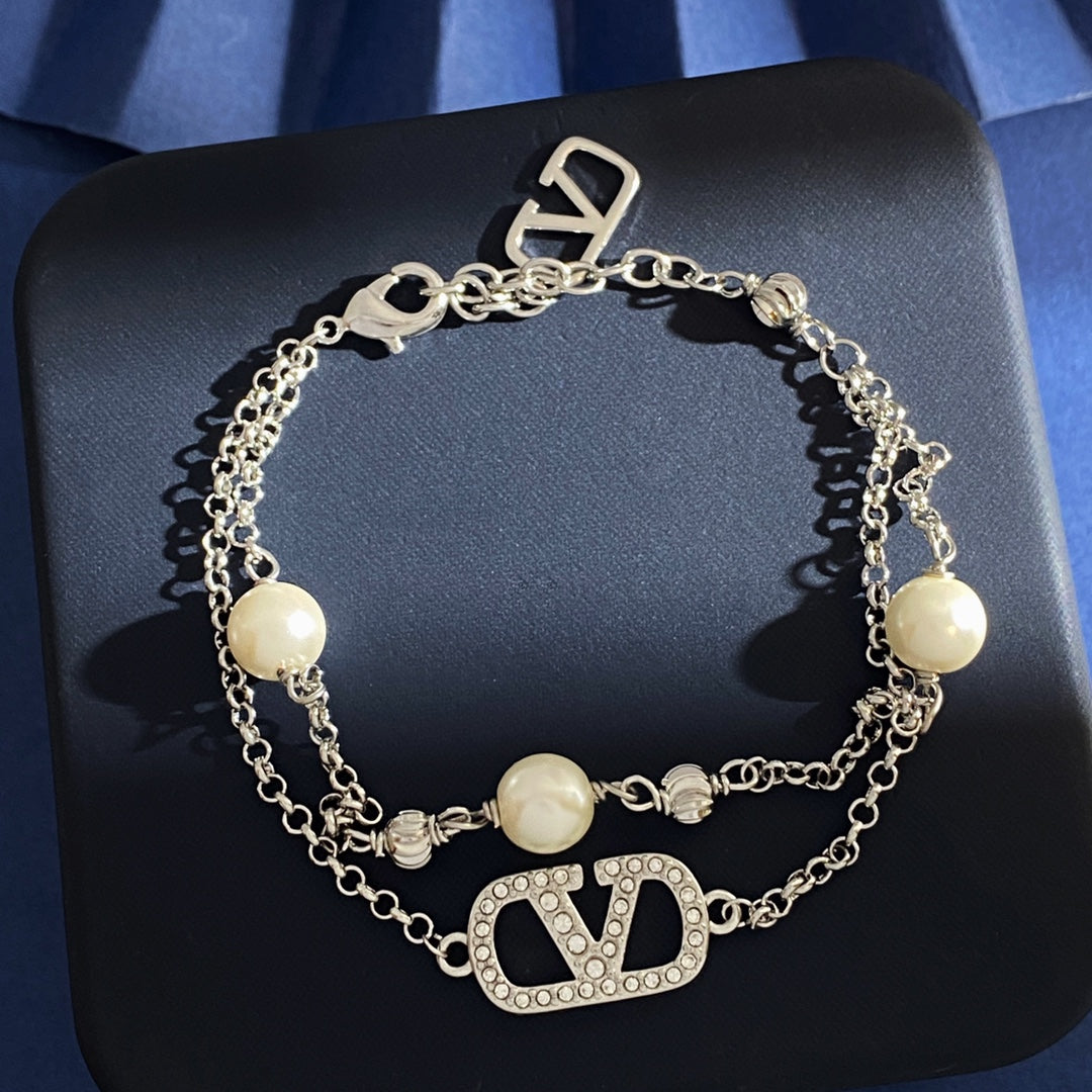 V Emblem Jewelry Accessory – White styled detail