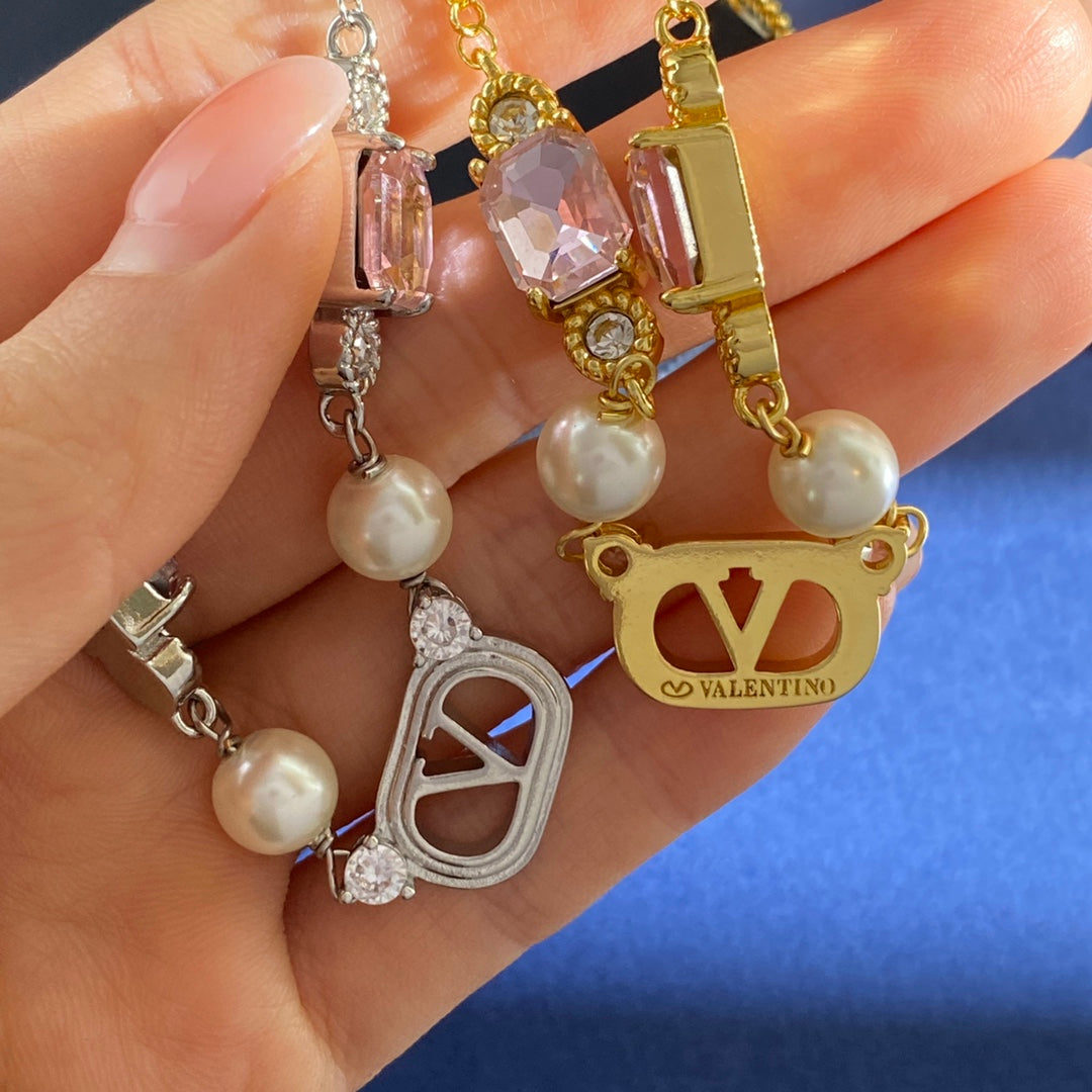 V Emblem Crystal-Accent Pendant Necklace – Pink styled detail