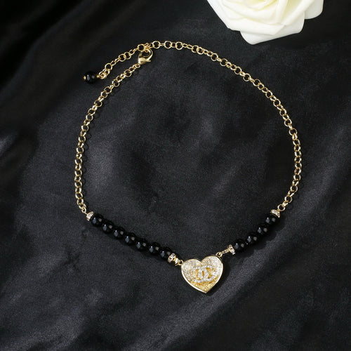 Double-C Emblem Pendant Necklace in Gold-Tone – Heart Detail main product view