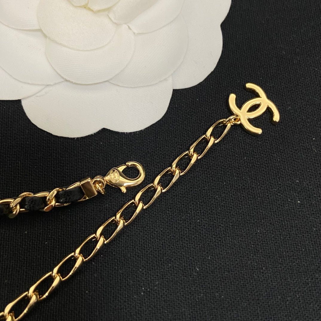 Double-C Emblem Pendant Necklace in Polished Metal-Tone – Black Detail – Design 002 close-up detail