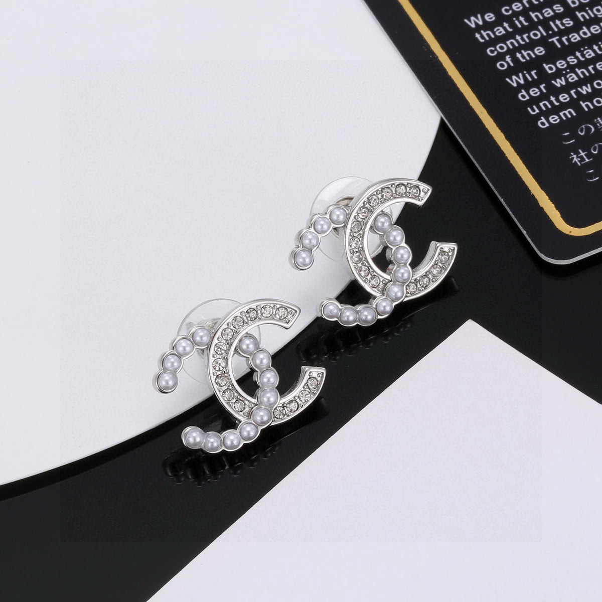 Signature Emblem Stud Earrings in Polished Metal-Tone – Design 008 close-up detail