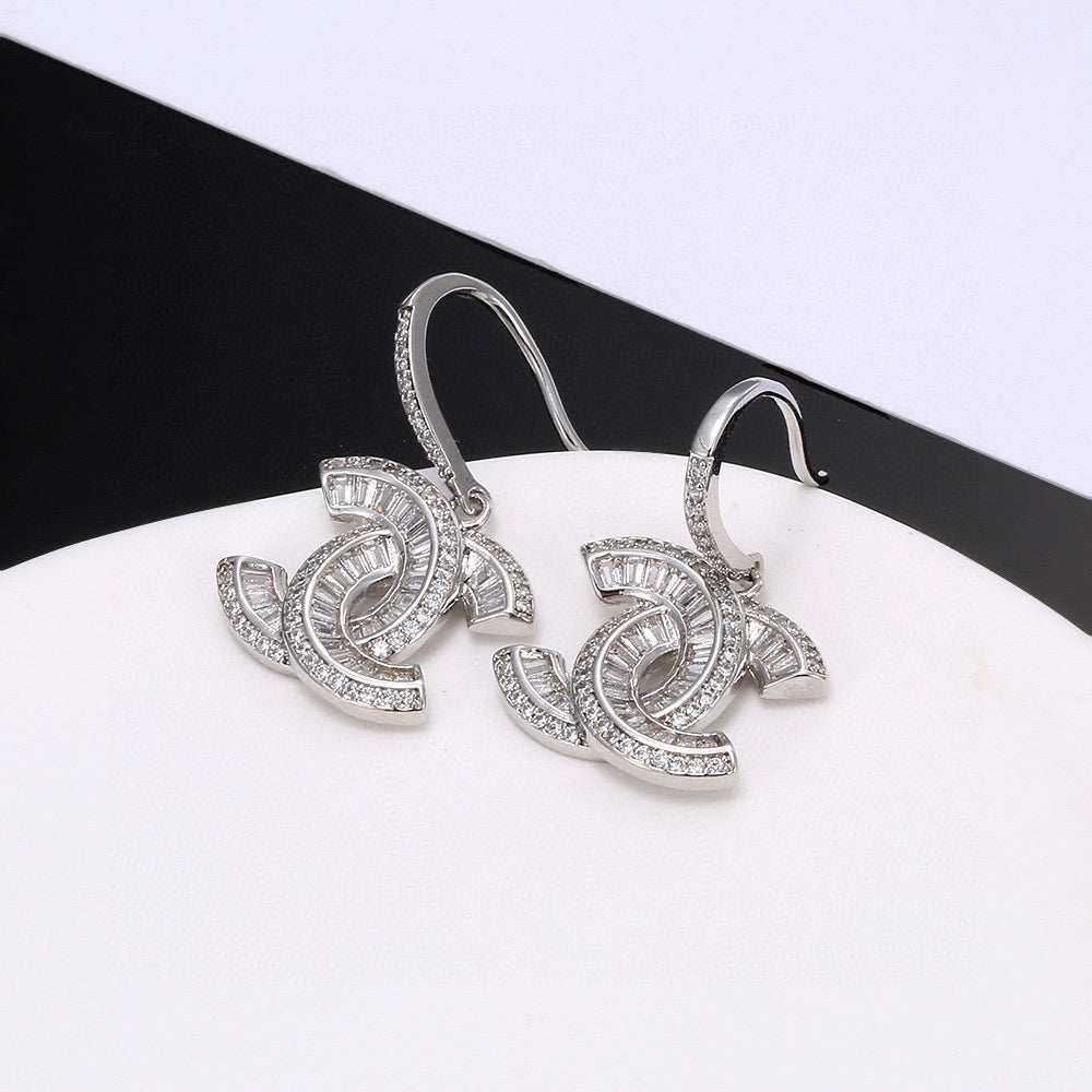 Signature Emblem Stud Earrings in Polished Metal-Tone – Design 007 detail view
