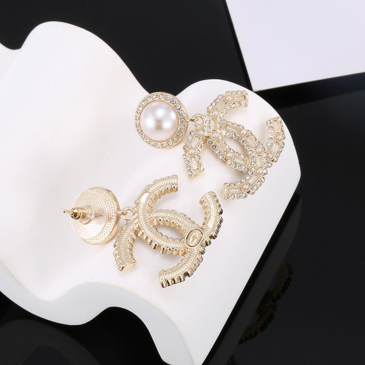 Double-C Emblem Pearl-Detail Stud Earrings – Pearl Detail close-up detail