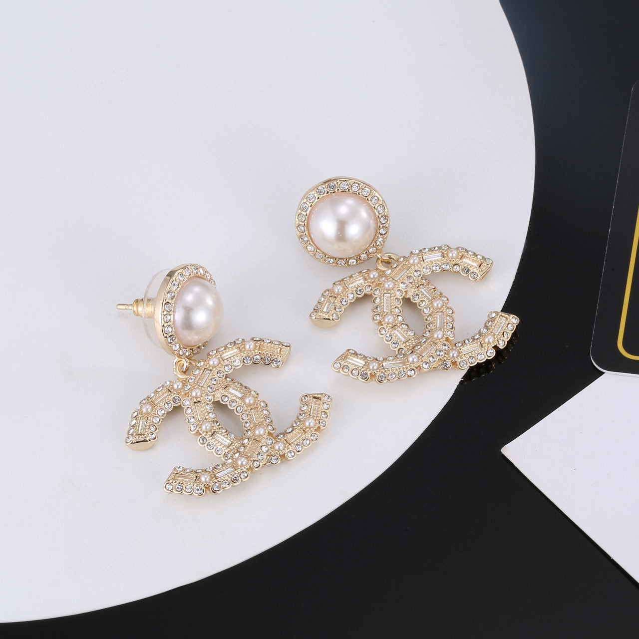 Double-C Emblem Pearl-Detail Stud Earrings – Pearl Detail front product view