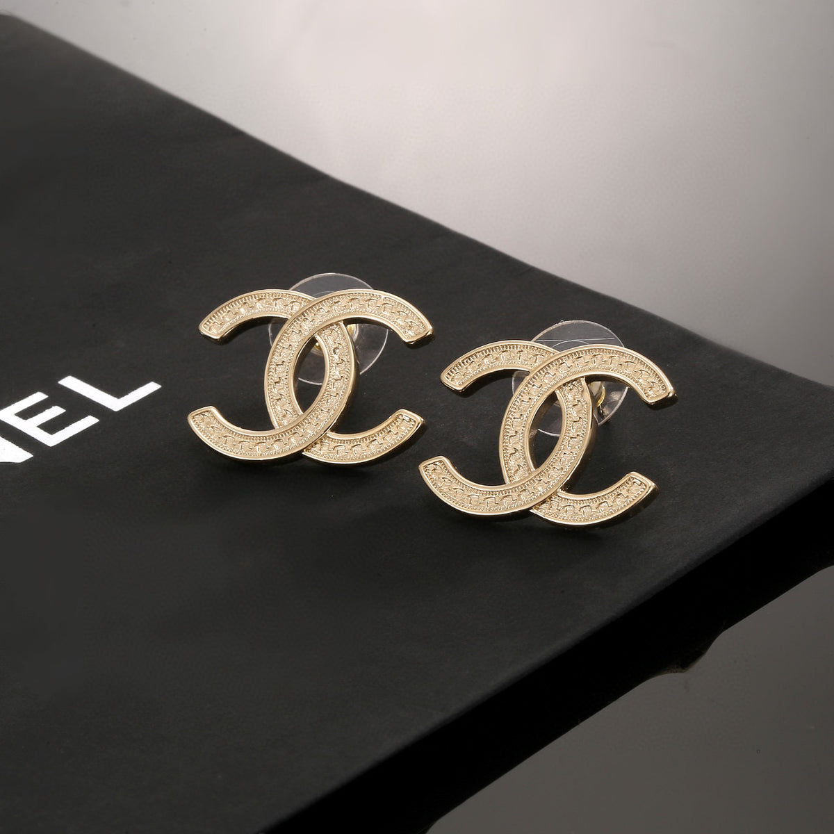 Signature Emblem Stud Earrings in Silver-Tone – Design 003 detail view