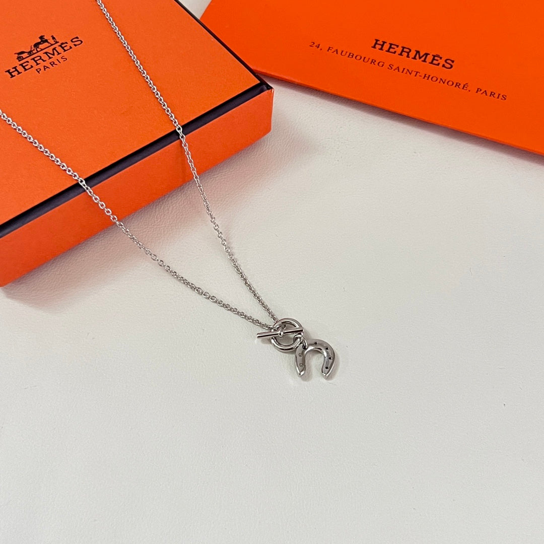 Martin Graham pendant necklace in polished metal-tone – detail view
