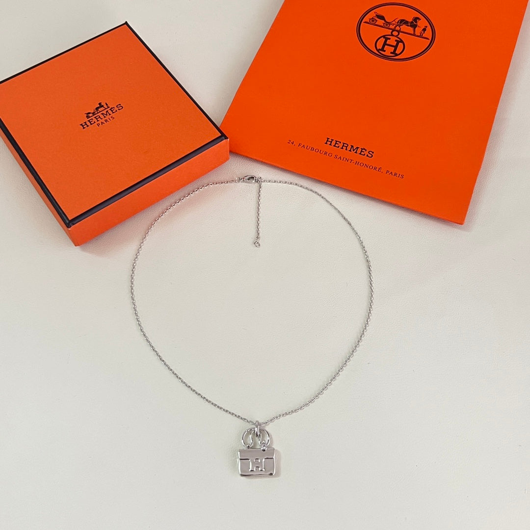 Martin Graham pendant necklace in polished metal-tone – front product view