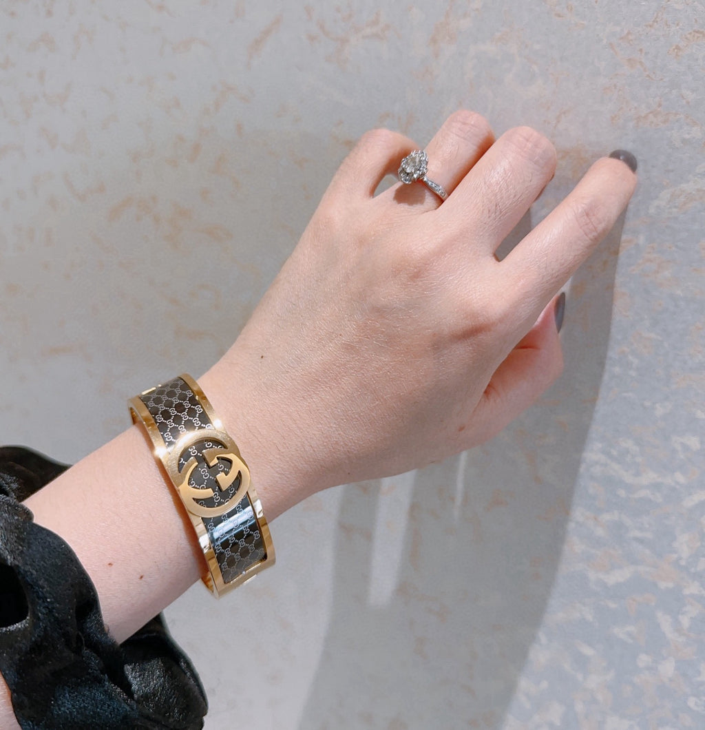 Double-G Emblem Bangle in Polished Metal-Tone – Design 001 detail view