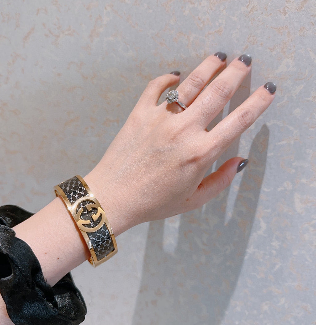 Double-G Emblem Bangle in Polished Metal-Tone – Design 001 detail view
