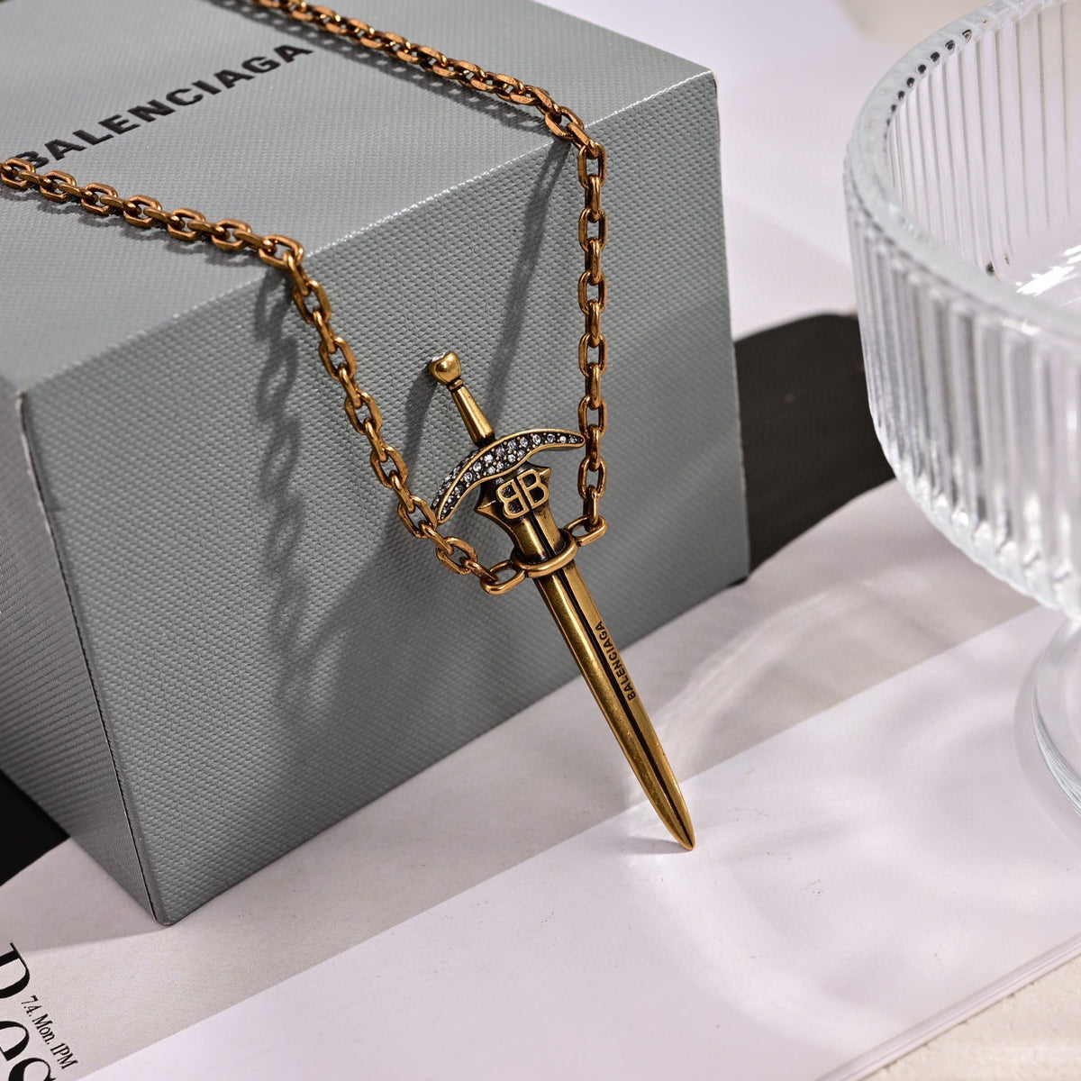 Martin Graham pendant necklace in polished metal-tone – side detail