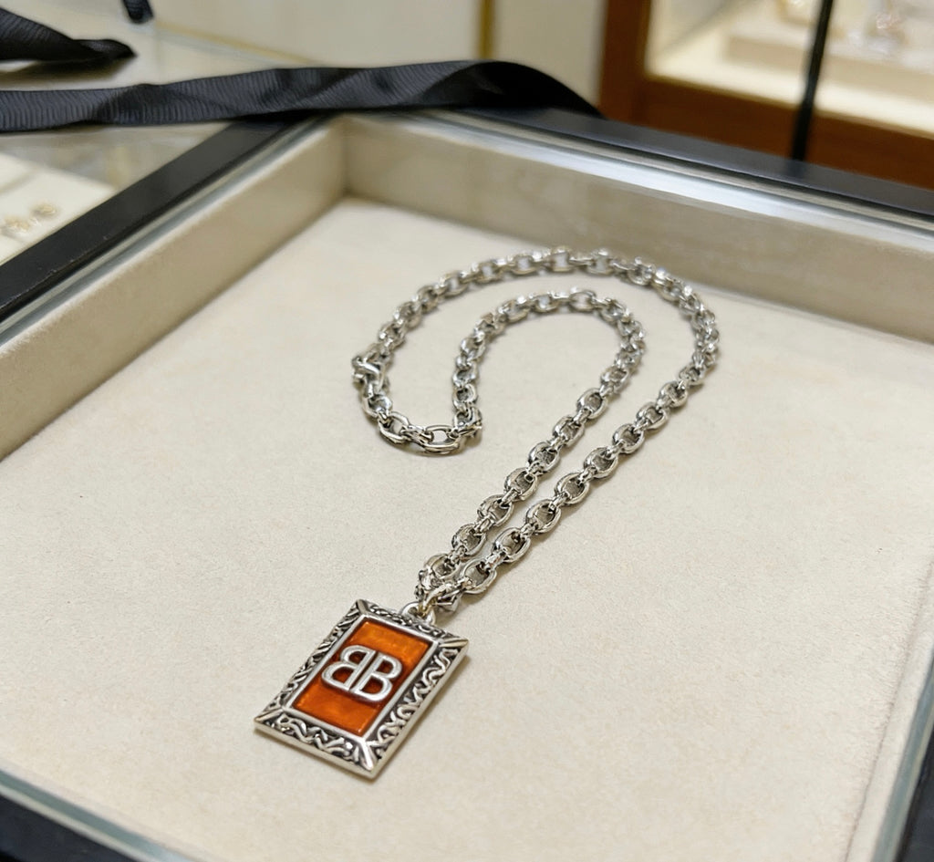 Martin Graham pendant necklace in polished metal-tone – styled product view