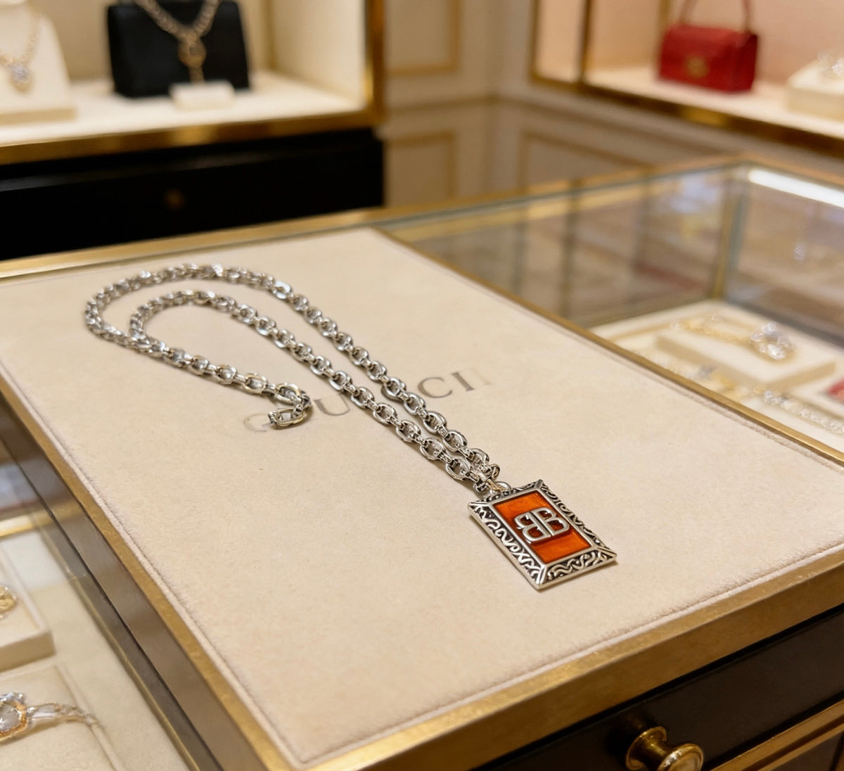 Martin Graham pendant necklace in polished metal-tone – detail view