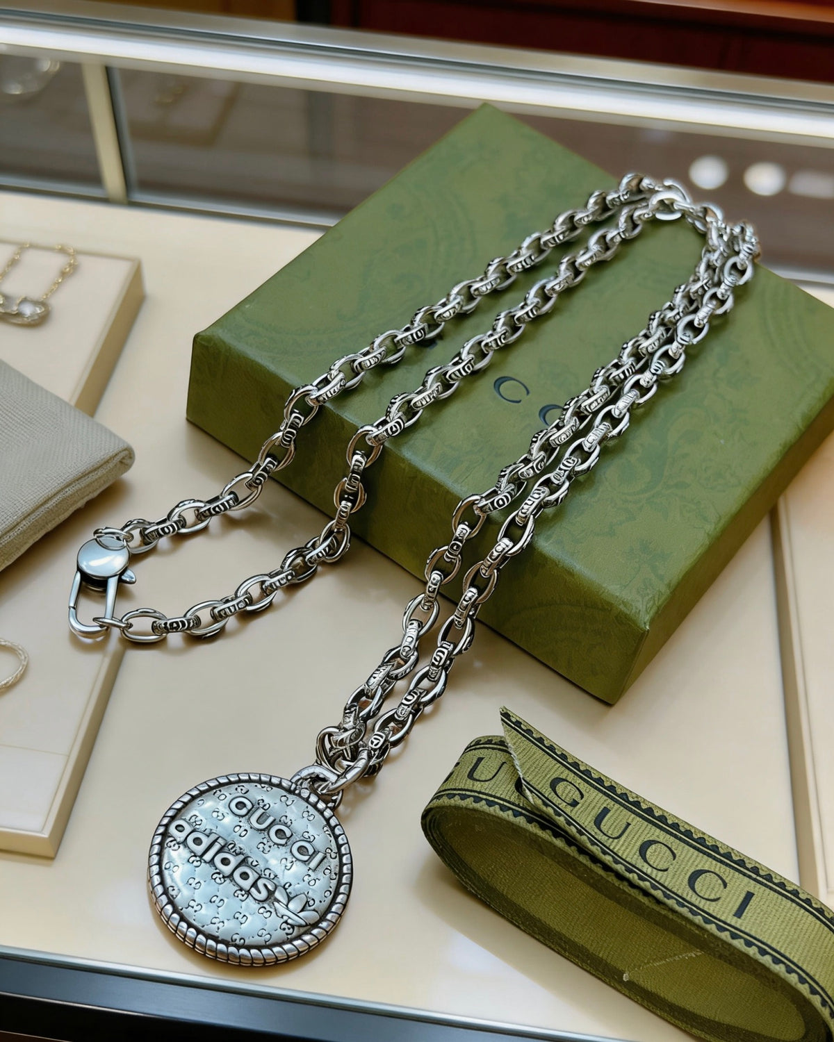 Double-G Emblem Pendant Necklace in Polished Metal-Tone – Vintage Detail – Design 027 close-up detail