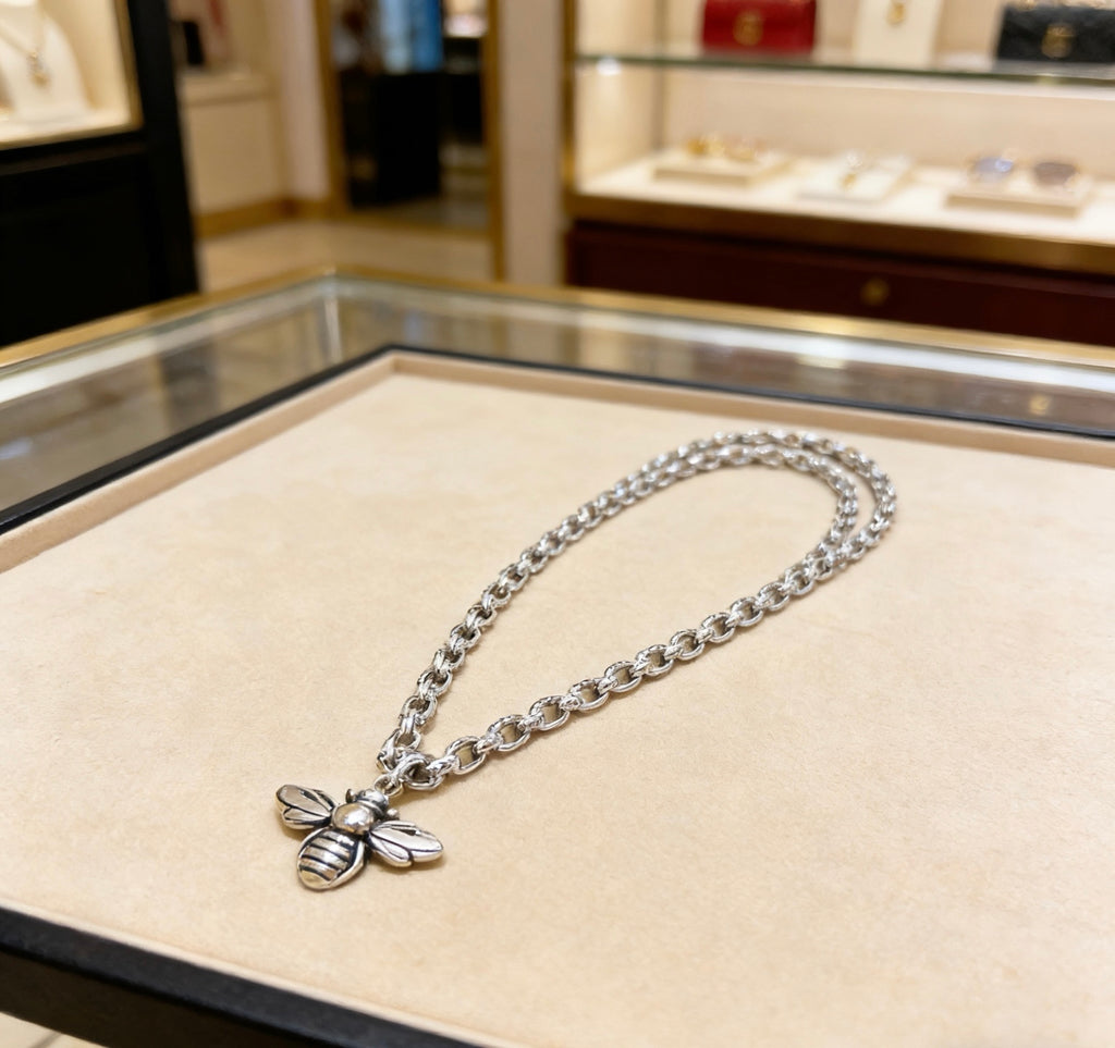 Double-G Emblem Pendant Necklace in Silver-Tone – Bee Detail close-up detail
