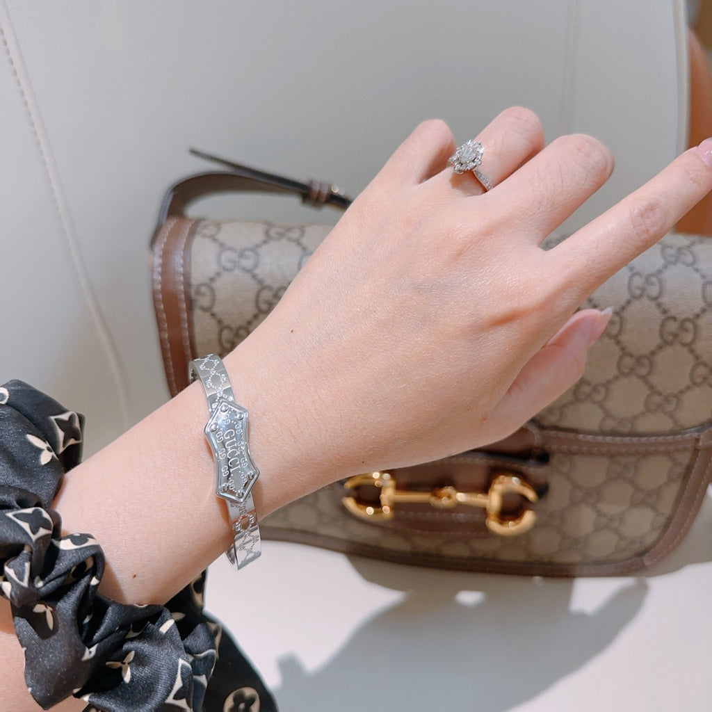 Double-G Emblem Bangle in Polished Metal-Tone – Design 016 styled product view
