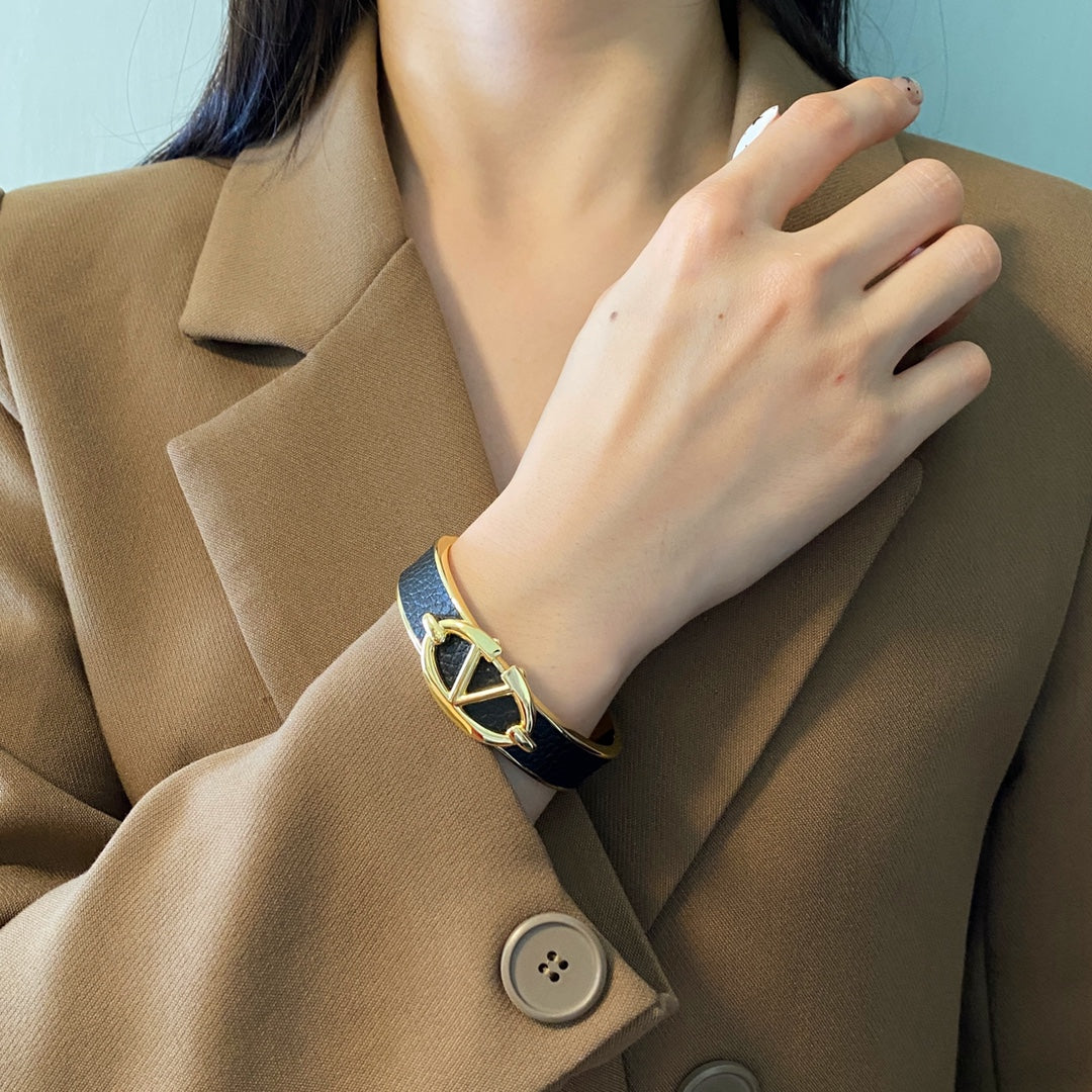 V Emblem Cuff Bracelet in Gold-Tone – Black front view