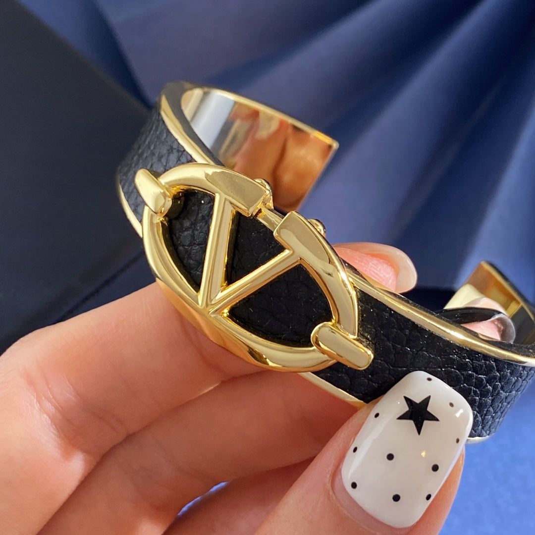 V Emblem Cuff Bracelet in Gold-Tone – Black styled detail