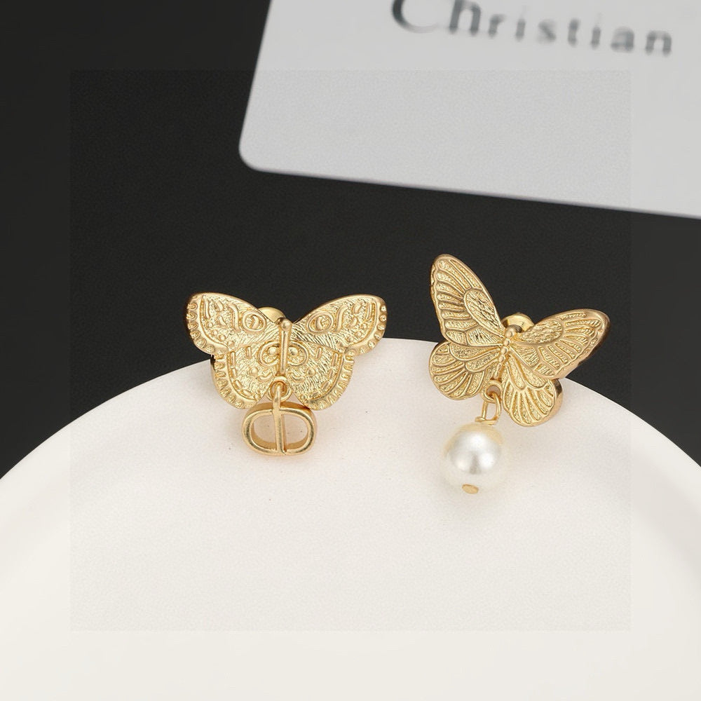 Bow & Butterfly Motif Stud Earrings in Silver-Tone with Asymmetric Detail – Design 003 styled view