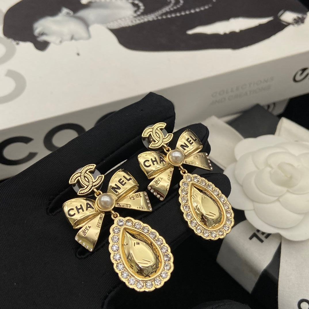 Bow Stud Earrings in Polished Metal-Tone – Design 001 detail view
