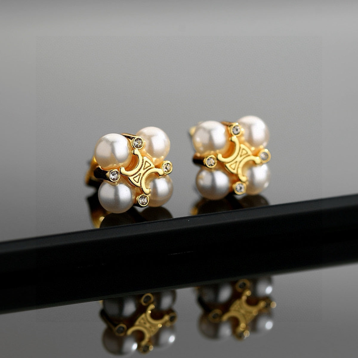 Signature Emblem Stud Earrings in Gold-Tone – Design 03 close-up view