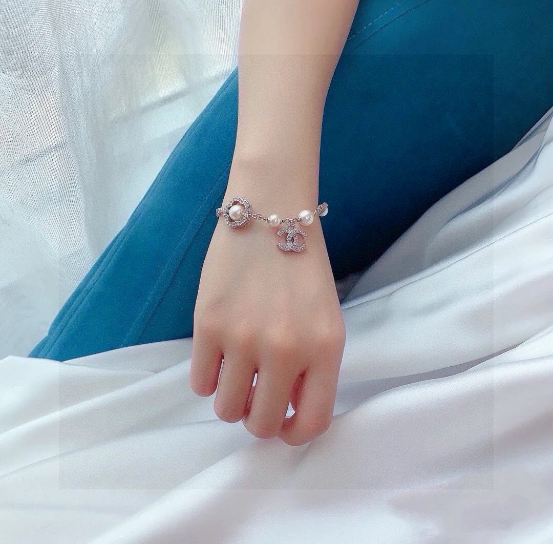 Camellia Bracelet in Polished Metal-Tone – Pearl Detail detail view
