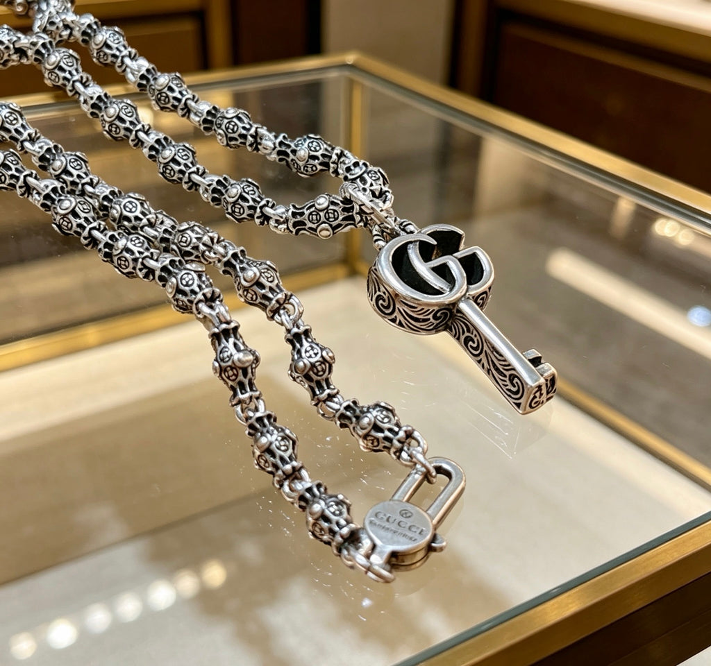 Double-G Emblem Pendant Necklace in Polished Metal-Tone – Design 106 close-up detail