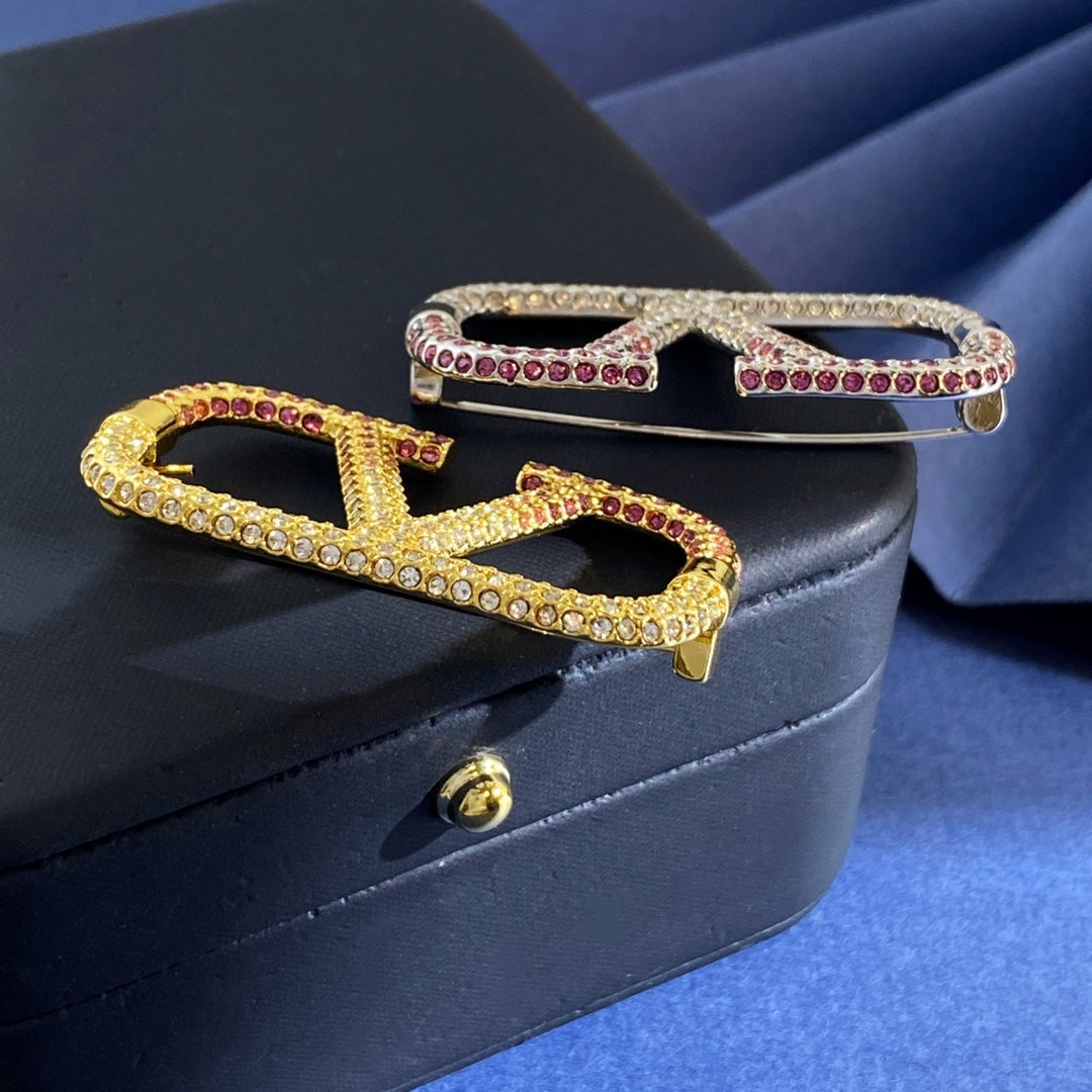 V Emblem Crystal-Accent Brooch styled detail