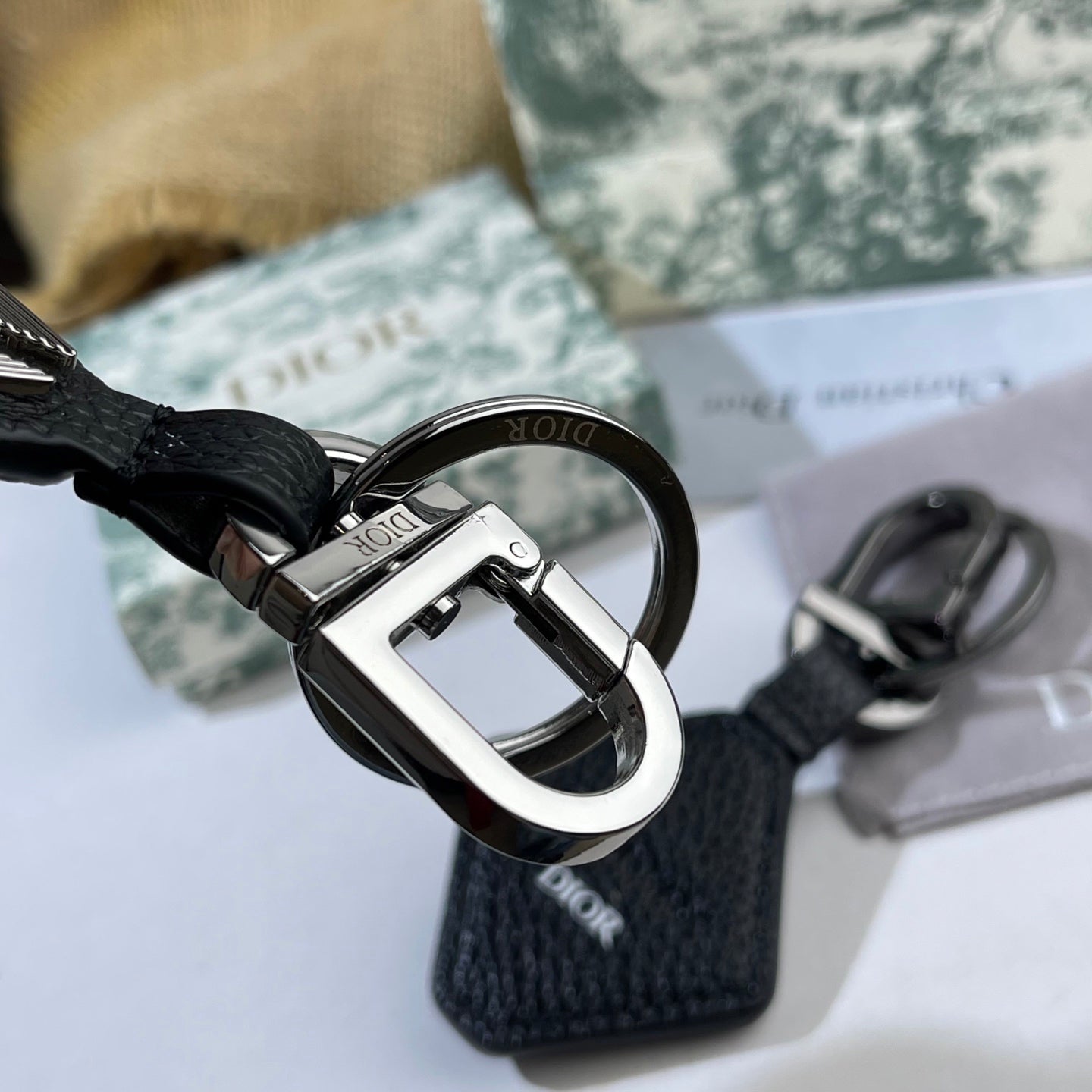 Graphic Letter Motif Bag Charm in Black-Tone close-up detail