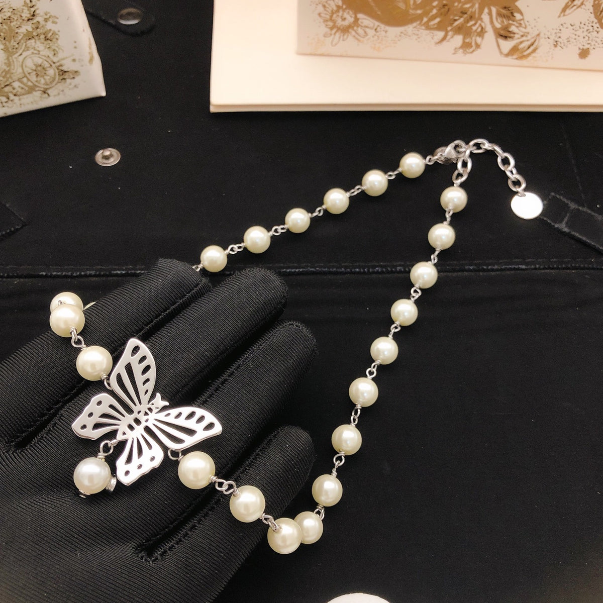 Bow & Butterfly Motif Pendant Necklace in Polished Metal-Tone with Pearl-Style Detail – Design 002 main product view