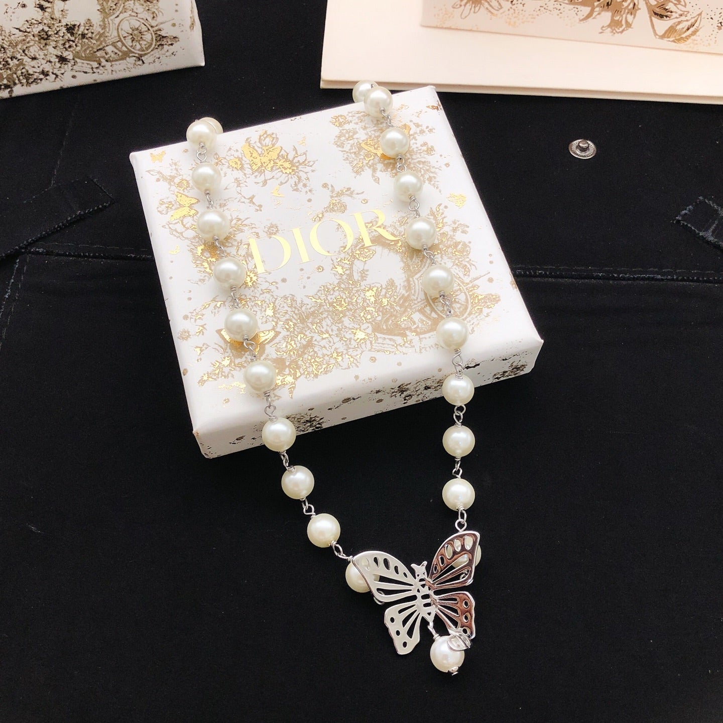 Bow & Butterfly Motif Pendant Necklace in Polished Metal-Tone with Pearl-Style Detail – Design 002 detail view