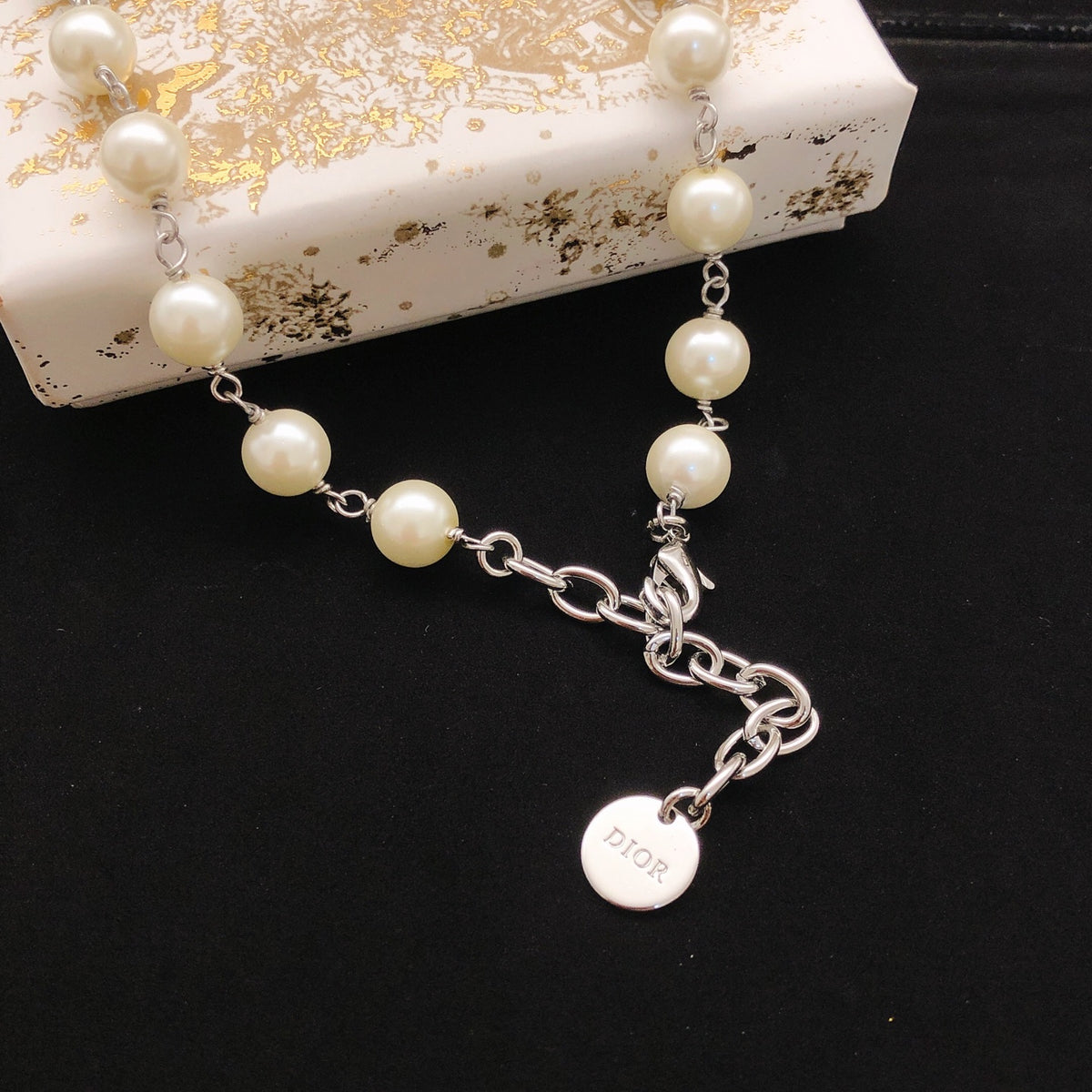 Bow & Butterfly Motif Pendant Necklace in Polished Metal-Tone with Pearl-Style Detail – Design 002 side detail