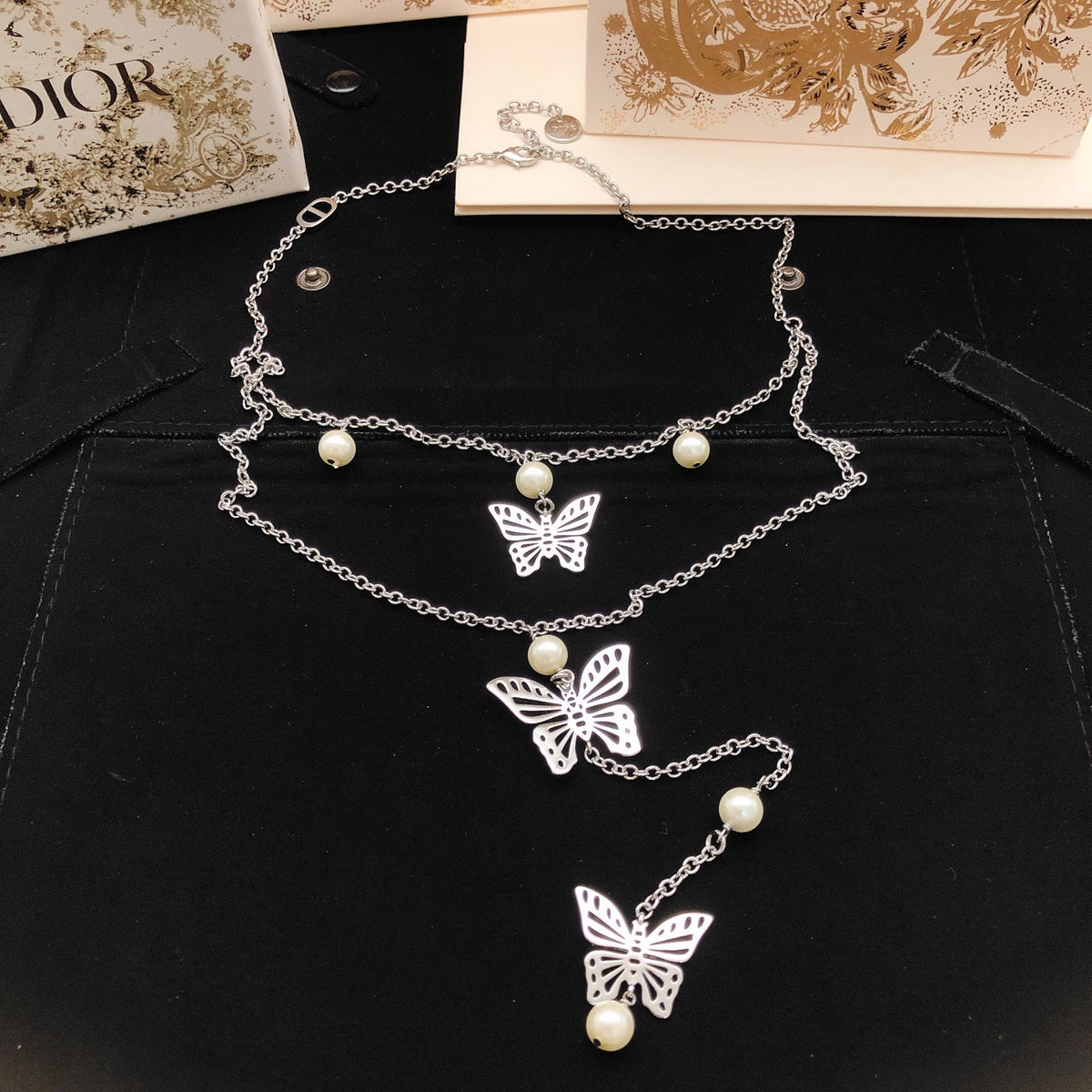 Bow & Butterfly Motif Pendant Necklace in Silver-Tone with Layered Detail front view