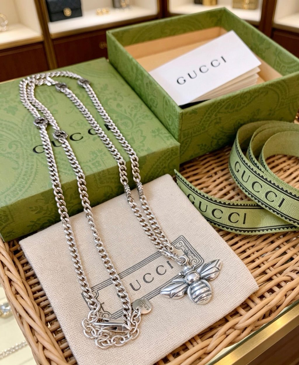 Double-G Emblem Pendant Necklace in Polished Metal-Tone – Bee Detail detail view