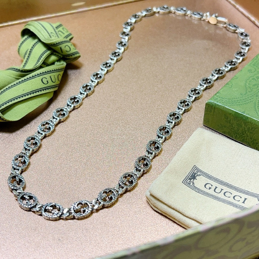 Martin Graham pendant necklace in polished metal-tone – side detail