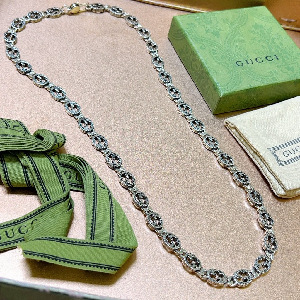 Martin Graham pendant necklace in polished metal-tone – detail view