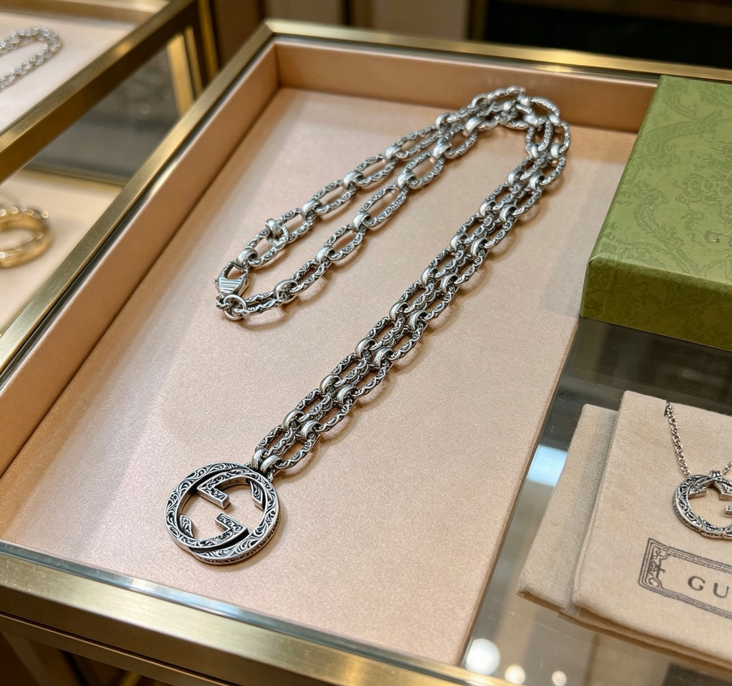 Martin Graham pendant necklace in polished metal-tone – front product view