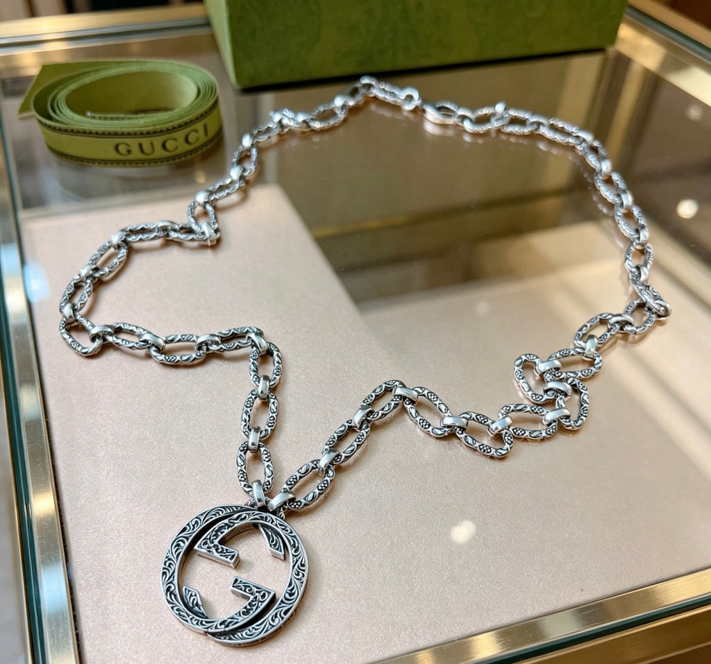 Martin Graham pendant necklace in polished metal-tone – detail view