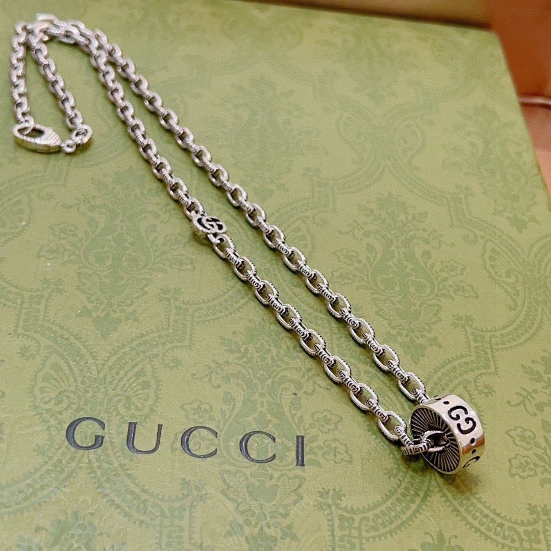 Double-G Emblem Pendant Necklace in Polished Metal-Tone – Design 128 close-up detail