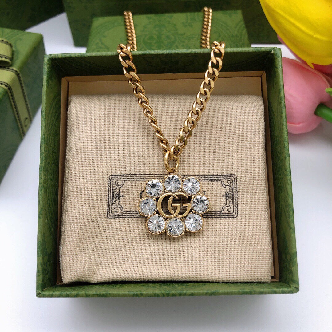 Geometric Emblem Pendant Necklace in Polished Metal-Tone – Crystal Detail detail view