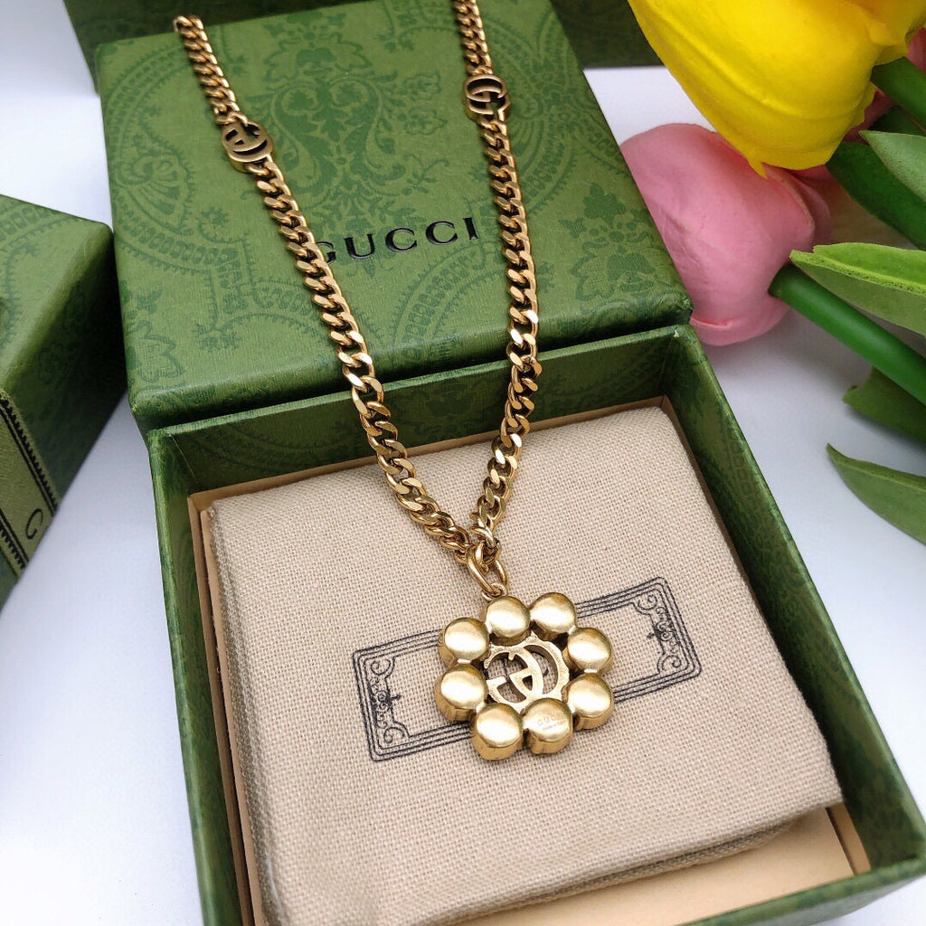 Geometric Emblem Pendant Necklace in Polished Metal-Tone – Crystal Detail close-up detail