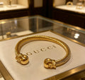 Double-G Emblem Bangle in Polished Metal-Tone – Design 024 main product view