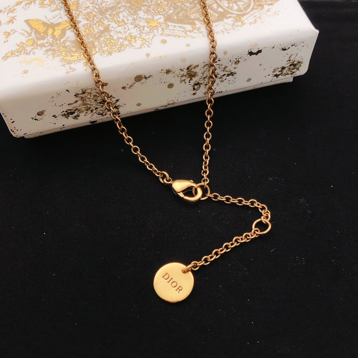 Graphic Letter Motif Pendant Necklace in Polished Metal-Tone – Design 015 front view