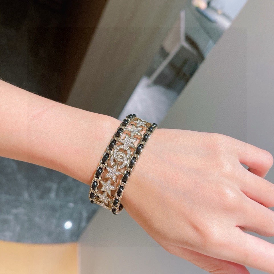 Signature Emblem Bangle in Polished Metal-Tone – Black Detail – Design 003 close-up detail