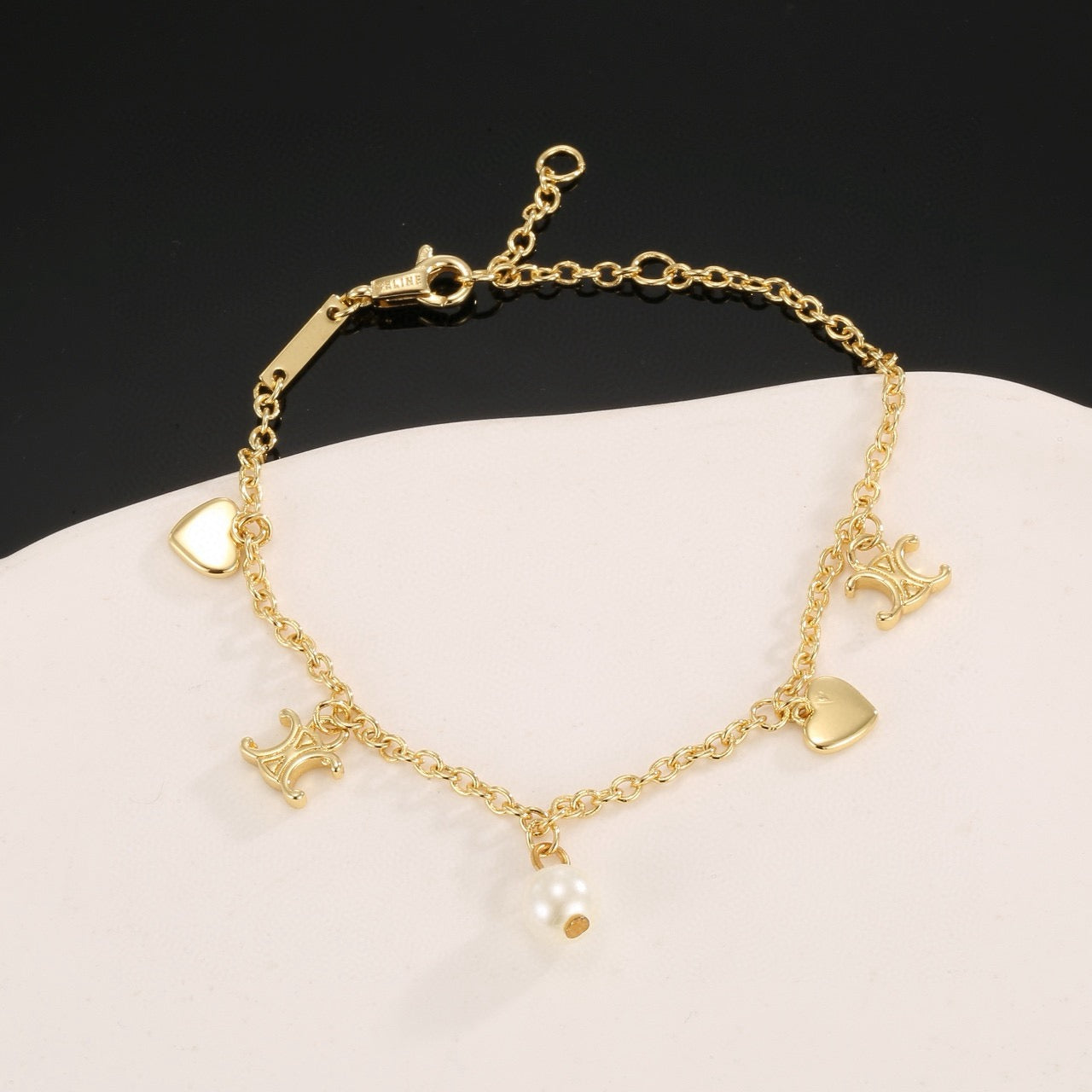 Signature Emblem Bracelet in Polished Metal-Tone – Red Detail – Design 002 styled product view